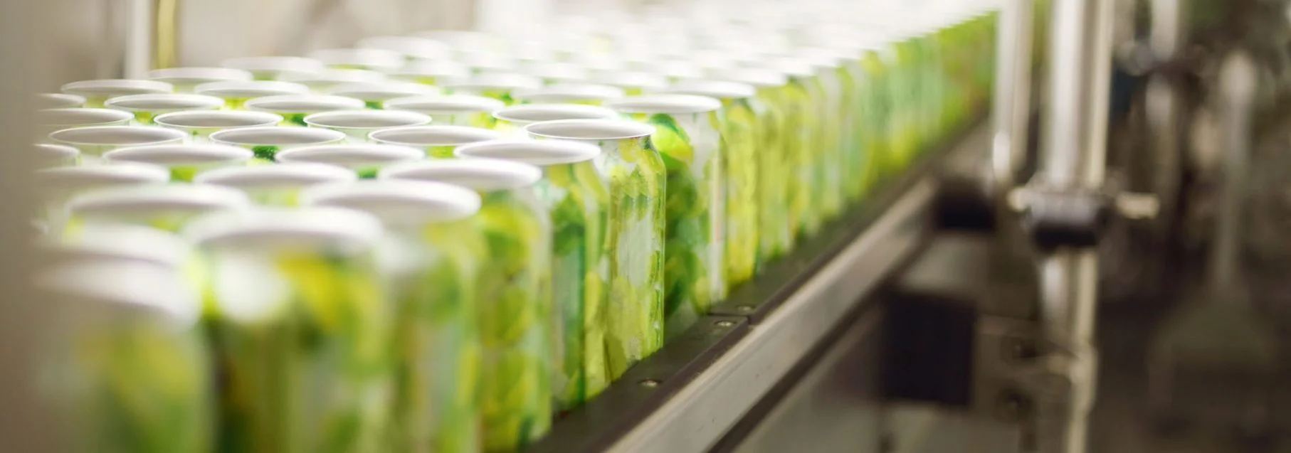 aluminum cans for drinks move on conveyor at large factory
